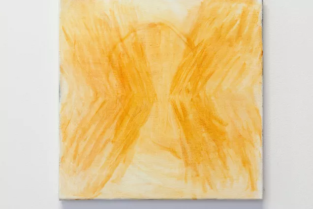 Yellow painting on a white wall. Photo. 
