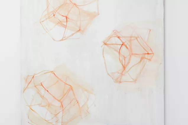 A white painting with peach colored cubes. Photo. 